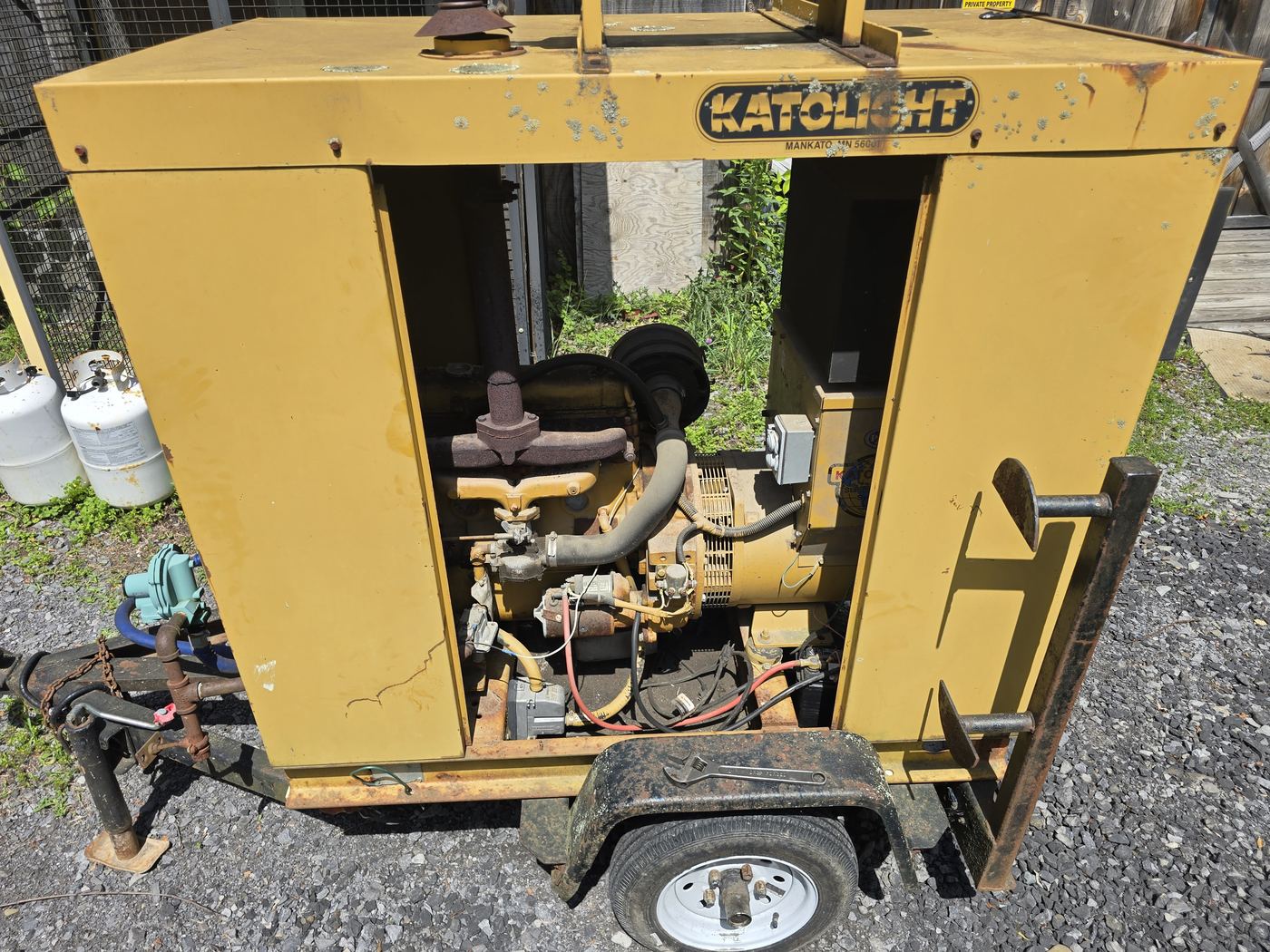 Towable Katolight diesel generator with side panels open for field service and troubleshooting